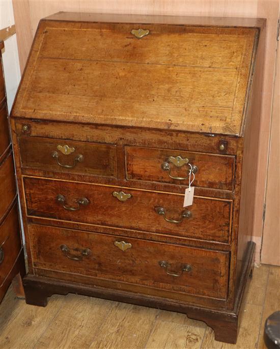 A small George III banded oak bureau, W.80cm